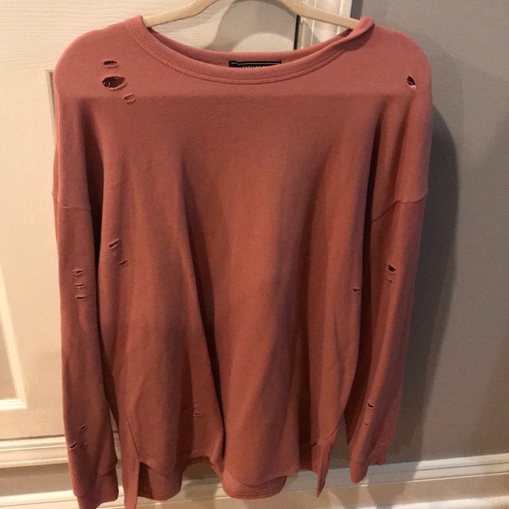 Pink oversized sweater with distressing